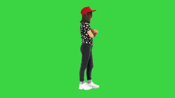 Young Asian Girl Posing To Camera on a Green Screen Chroma Key