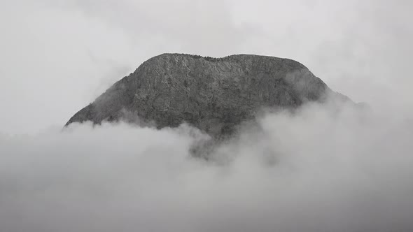 Flat Topped Mountain Summit Above Clouds