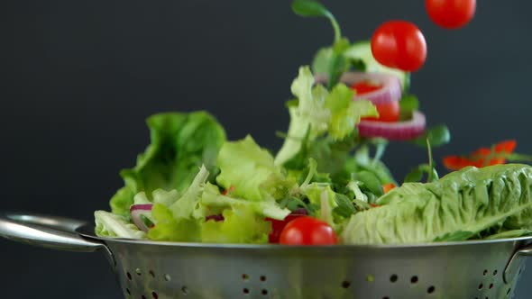 Fresh Salad Flying to Colander in Super Slow Motion