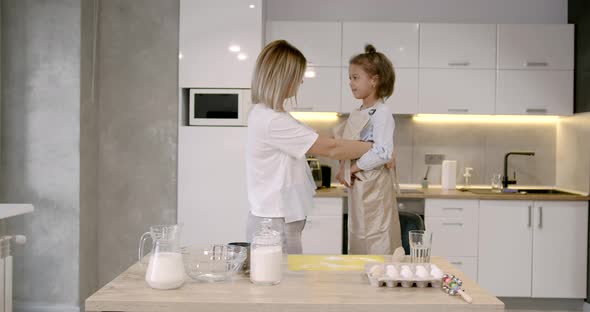 Mother and Daughter Having Fun While Making Dough on Kitchen