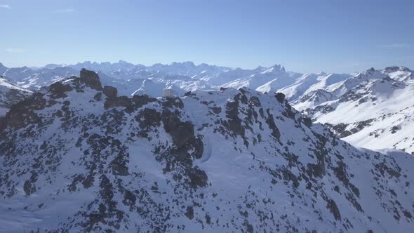 Flying over the peak of the Val Thorens's mountains, in the French Alps