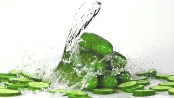 Super Slow Motion on Fresh Cucumbers Drops Water with Splashes