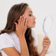 Young Woman Admiring Herself In Hand Mirror - VideoHive Item for Sale