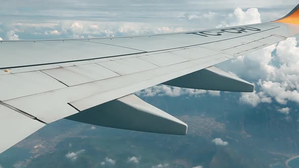 Wing of Airplane Through the Aircraft Window