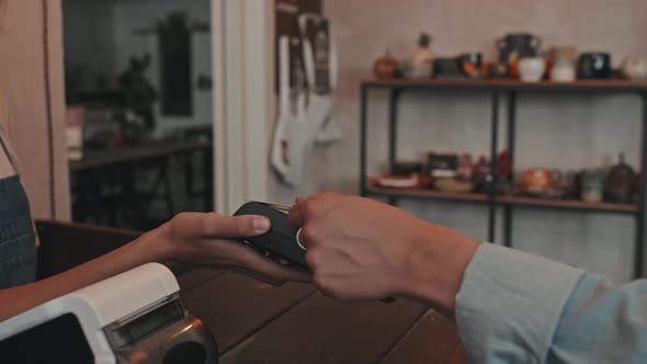 Paying with Credit Card in Pottery Shop