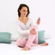 Smiling Woman Sitting On Bed Texting On The Phone 3 - VideoHive Item for Sale