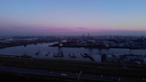 Extensive Harbour Of Maasvlakte In Rotterdam At Dusk. aerial