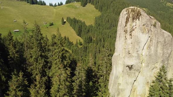 Aerial View of a Picturesque Rock Located Among the Spruce Forest in the Mountains