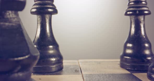 Special tracking macro shot moving between chess pieces on a chess board