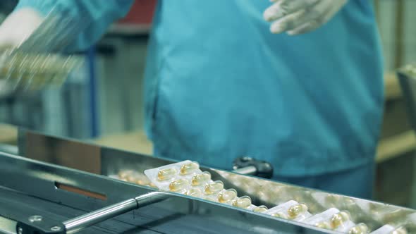 Blisters with Capsules Are Getting Removed From the Conveyor