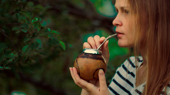 Young Woman Drinking Mate Outdoor