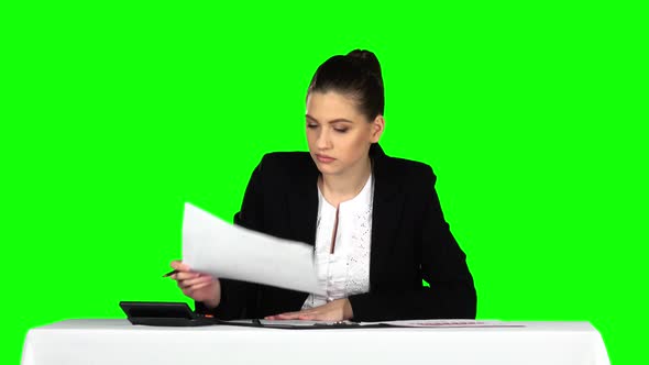 Business Woman Working From Office with Documents. Green Screen