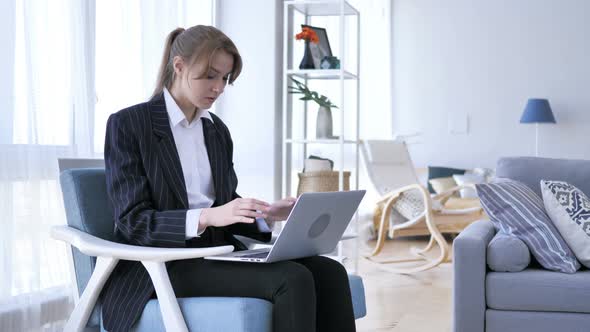 Upset Woman Working on Laptop in Office