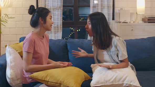 Young Asian women friends angry conflict together at home.