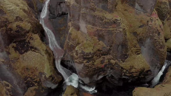 Cinematic aerial flyover of stunning Icelandic canyon.