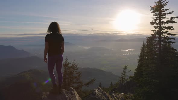 Adventurous Caucasian Adult Woman Hiking in Canadian Nature