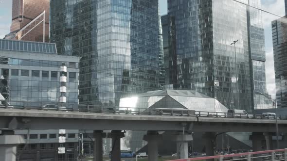 Urban View From Train Window. Glass Skyscrapers Moving Along