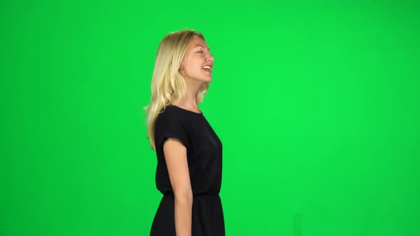 Woman Goes with Multicolored Paper Bags Enjoying Shopping. Chroma Key. Side View