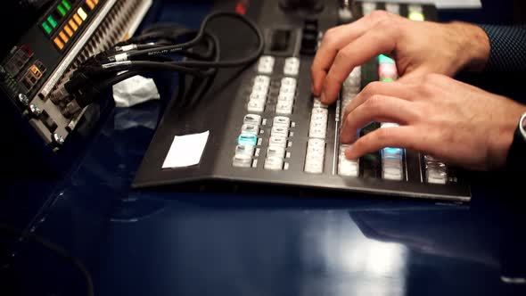 Engineer Press Key Buttons On Control Desk Recording Studio. Soundboard Pads On TV Station.