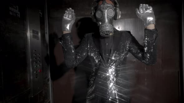 Man with Sparkling Gas Mask Dancing in a Lift / Videohive