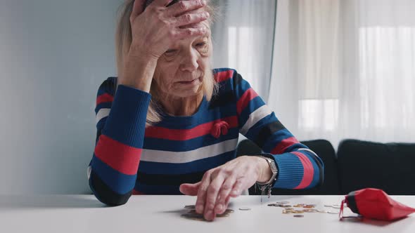 Poor Old Woman Counting Coins on the Table