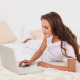 Young Woman Using Her Laptop Lying On Her Bed - VideoHive Item for Sale