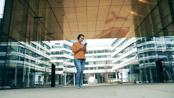 Urban Neighbourhood and a Gorgeous Lady Using Her Phone