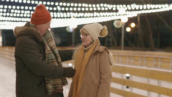 Elderly Couple Ice-Skating