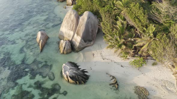 Aerial view of a person walking on the beach of Anse Lazio, Seychelles.