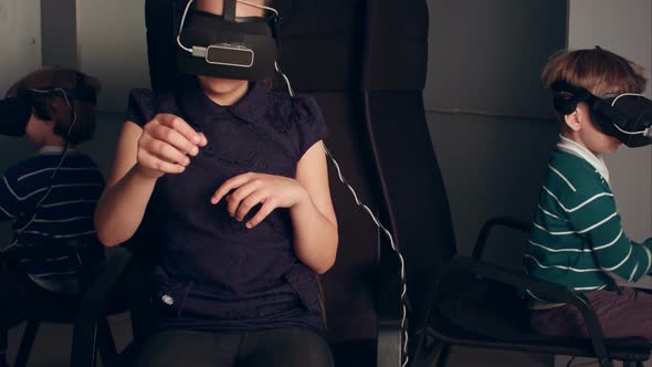 Three Little Kids in Vr Headsets Enjoying Virtual Reality Game