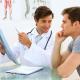 Smiling Doctor Discussing Xray With His Patient - VideoHive Item for Sale