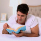 Happy Handsome Man Reading In Bed - VideoHive Item for Sale