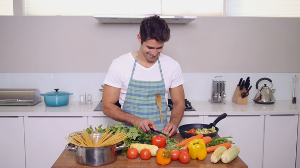 Handsome Man Chopping Vegetables