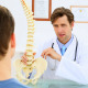 Doctor Showing Patient A Spine Model - VideoHive Item for Sale