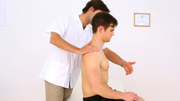 Physiotherapist Checking Patients Injured Shoulder 1