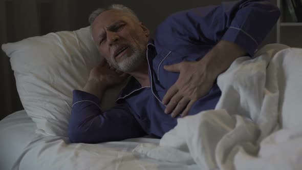 Senior Man Having Heart Attack, Suffering Sharp Chest Pain While Sleeping