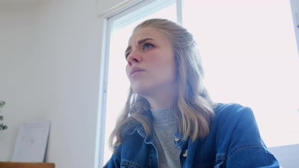 Young woman playing electronic piano at home