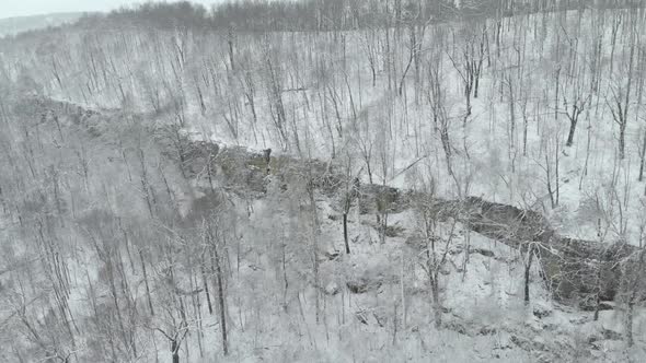 Aerial of Mountain Bluff In Winter With Snow