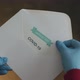 Person Opening Envelope with Certificate with Positive Results in Covid-19 - VideoHive Item for Sale