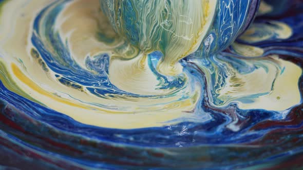 Paint Flows Down the Surface of the Texture Ball and Spreads Over the Table