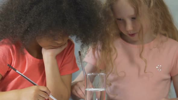 Young Students Using Acrylic Paint At Drawing Lesson In Kindergarten, Education