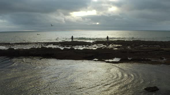 4k footage- Fisherman sunset work on Cascais coast in Portugal.