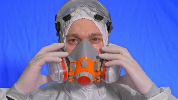 Scientist Virologist in Respirator. Man Close Up Look, Wearing Protective Medical Mask. Concept