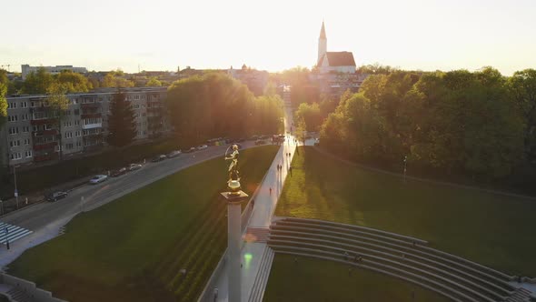 Static View Golden Boy Statue With Sunset Background