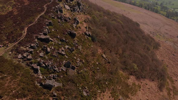 Drone travelling away from Bamford Edge Whilst panning up revealing Bamford Edge Aerial Shot in the