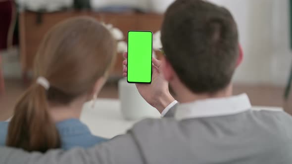 Couple Using Smartphone with Chroma Key Screen