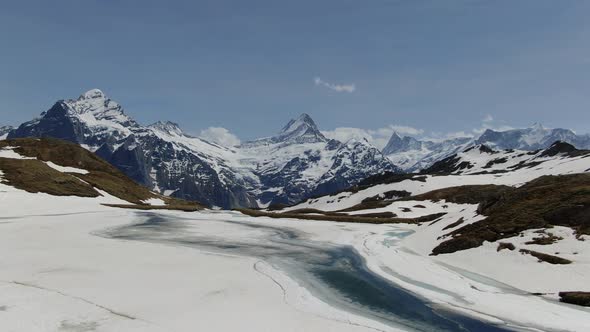 Wetterhorn and Schreckhorn mountains and Bachalpsee lake in Switzerland