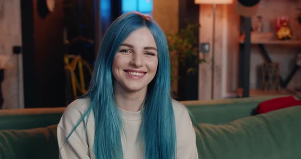 Portrait of Cheerful Beautiful Woman with Blue Hair Looking To Camera and Smiling, Modern Millennial