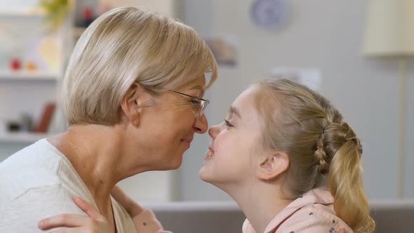 Granny and Granddaughter Nuzzling, Playing Games, Having Fun Together, Closeup