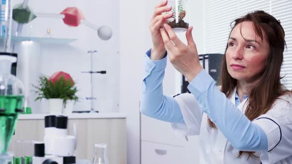 Portrait of Female Scientist Researcher Looking at Plant Samples